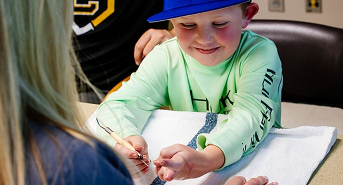 6-year-old UAB patient back to playing baseball after traumatic injury to hand